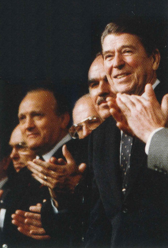 Hughes on platform with President Ronald Reagan at the 1983 National Association of Evangelicals convention