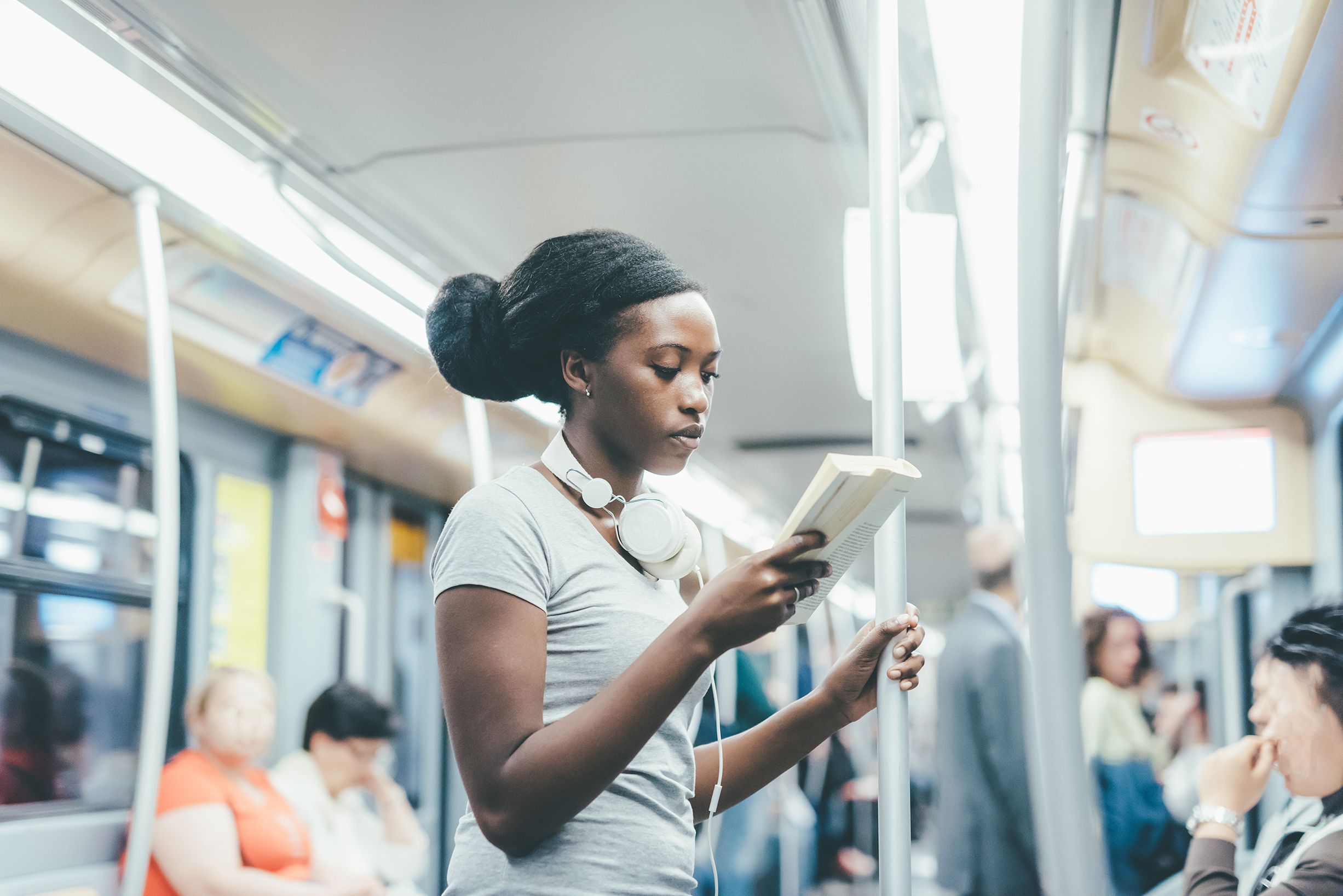 Girl reading on subway