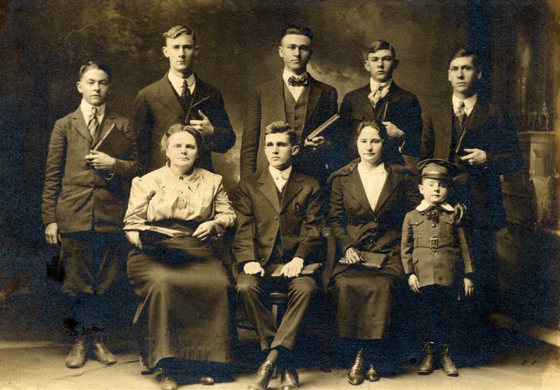 Nora Chambers, sitting with open Bible, and students attending the fall 1918 term of the Church of God Bible Training School