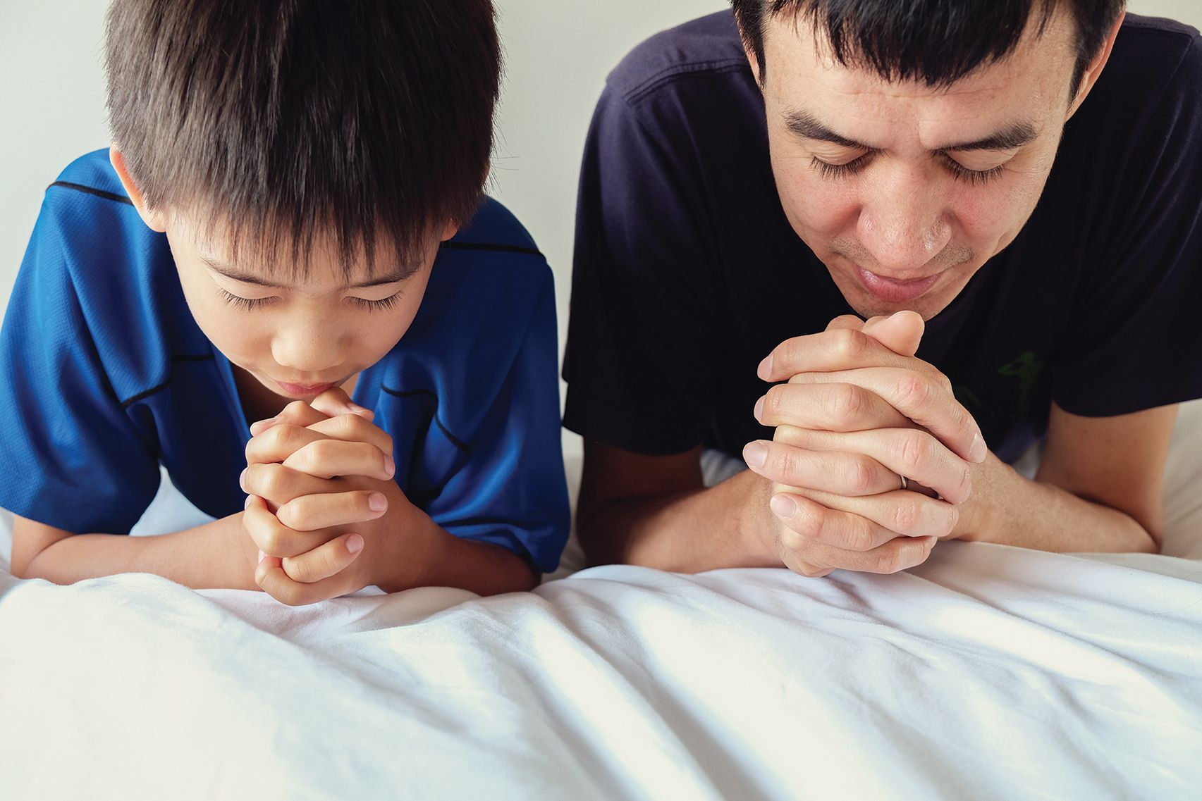 father and son praying