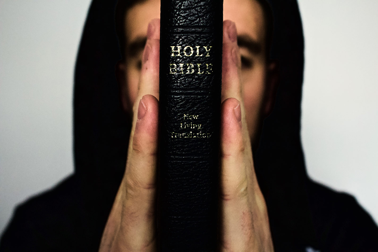 man holding bible