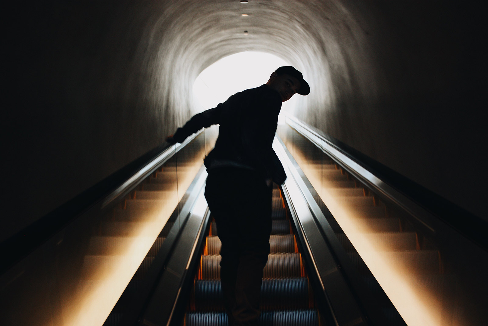 man on escalator